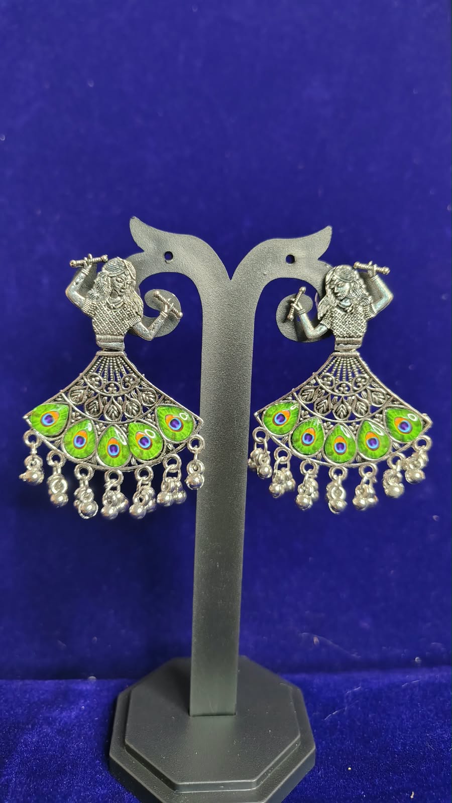 Peacock Flute Player Oxidized Earrings close up showing silver oxidized finish and ghungroo drops