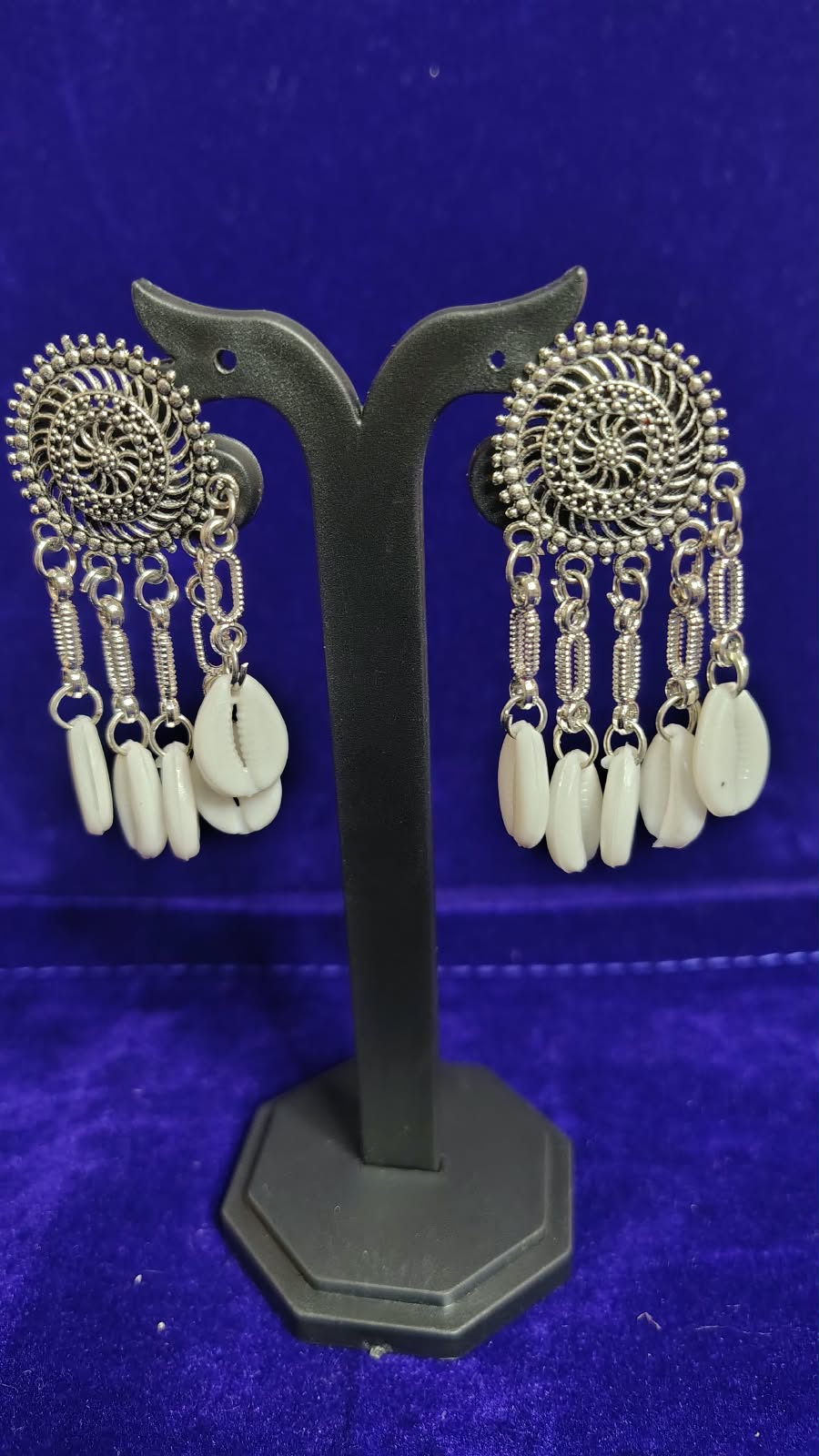 Oxidized Spiral Cowrie Shell Earrings - Angle View