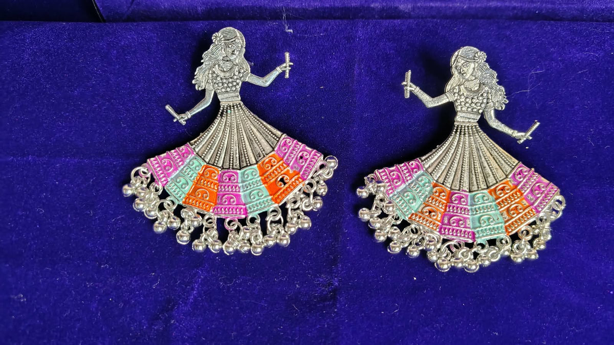 Dandiya Dancer Oxidized Earrings on display stand showing full design